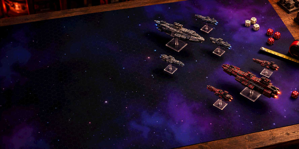 Spaceship miniatures in battle on a star field gaming mat